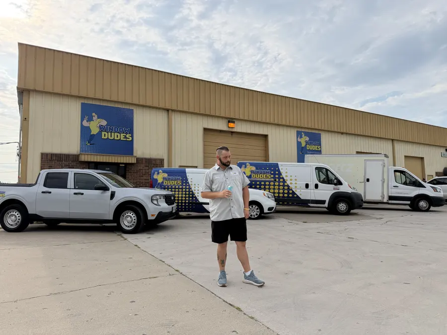 Window Dudes team member with branded vans at the Springfield shop